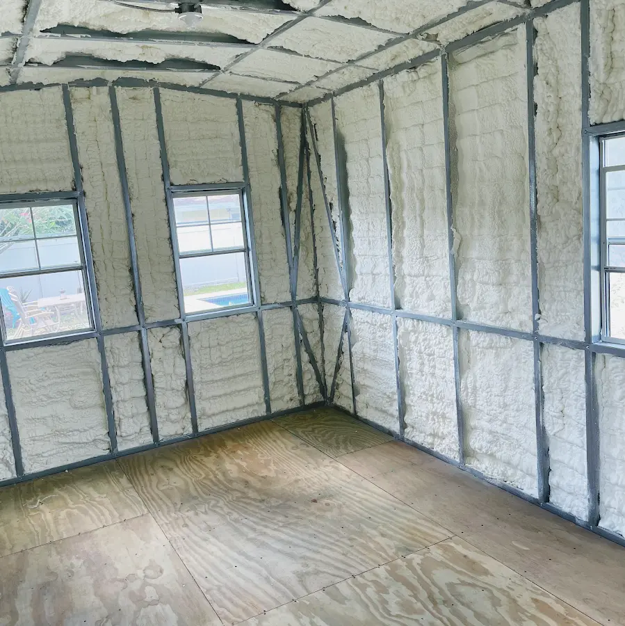 Closed-cell spray foam insulation applied to wall cavities in a residential project in Brownsville