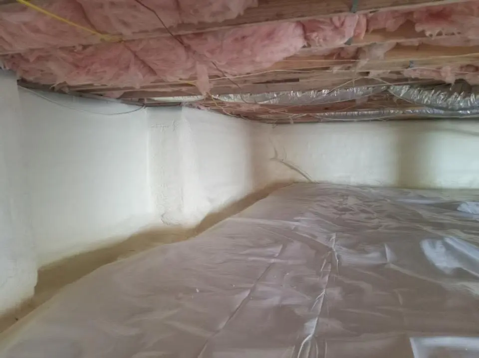 Crawl space encapsulation with closed-cell spray foam for Commercial Roof Restoration in Brownsville